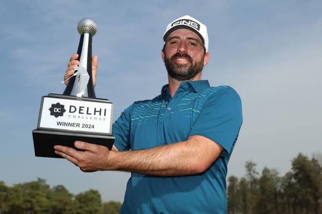 DELHI, INDIA - MARCH 17: John Parry of England poses with the trophy during day four of the Delhi Challenge at Classic Golf & Country Club on March 17, 2024 in Delhi, India. (Photo by Luke Walker/Getty Images)