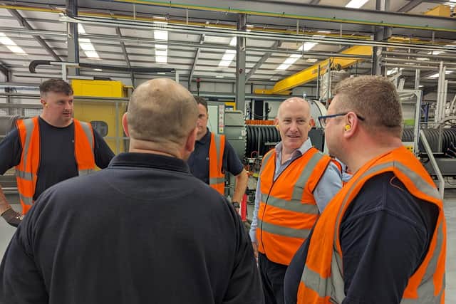 Genuit's CEO Joe Vorih (light blue shirt) on site at the group's Horncastle operations. (Photo supplied by Genuit)