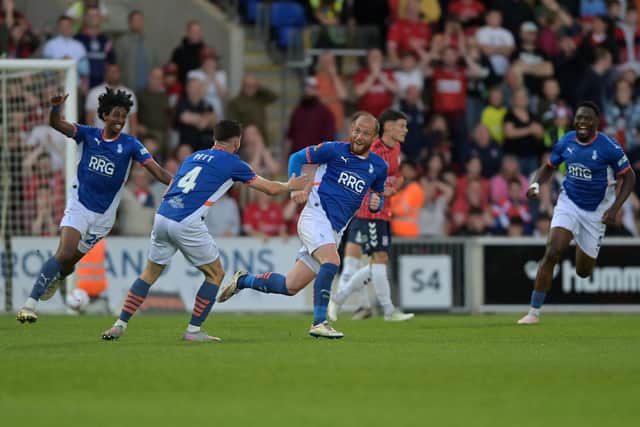 Oldham Athletic's Joe Garner celebrates opening the scoring at York. Picture: Jonathan Gawthorpe