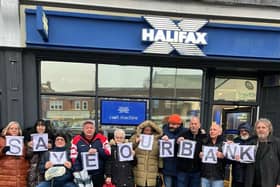 Residents protesting outside the Hessle Halifax Branch. Councillor Simon Pickering is on the far right.