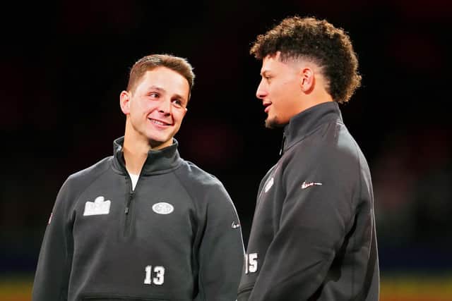 Brock Purdy of the San Francisco 49ers (L) and Patrick Mahomes of the Kansas City Chiefs meet on stage during Super Bowl LVIII Opening Night at Allegiant Stadium (Picture: Chris Unger/Getty Images)