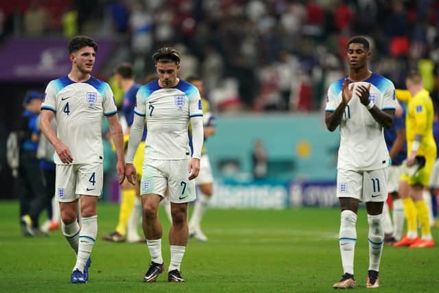 Left to right, England's Declan Rice, Jack Grealish and Marcus Rashford appear dejected after the FIFA World Cup Group B match at the Al Bayt Stadium in Al Khor, Qatar. Picture: Mike Egerton/PA Wire.