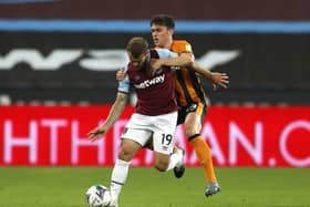 West Ham United's Jack Wilshere (left) and Hull City's Callum Jones (right) battle for the ball during the Carabao Cup third round match at the London Stadium in September 2020 (Picture: PA).