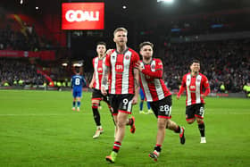 LATE HERO: Sheffield United's Oli McBurnie celebrates scoring his team's second goal from the penalty spot