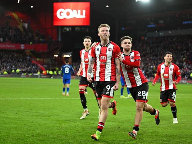 LATE HERO: Sheffield United's Oli McBurnie celebrates scoring his team's second goal from the penalty spot