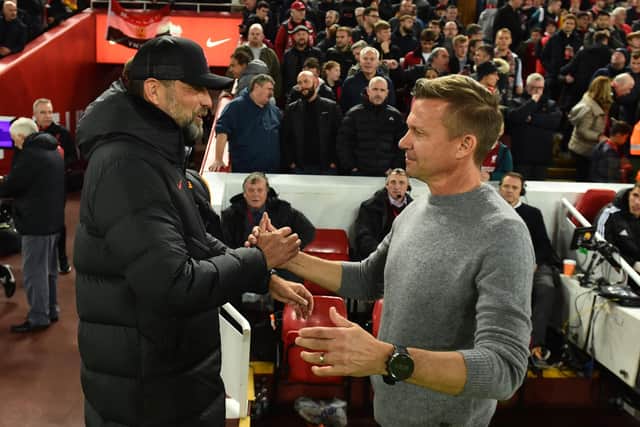 LIVERPOOL, ENGLAND - OCTOBER 29: Jurgen Klopp manager of Liverpool with Jesse Marsch Manager of Leeds United  before the Premier League match between Liverpool FC and Leeds United at Anfield on October 29, 2022 in Liverpool, England. (Photo by Andrew Powell/Liverpool FC via Getty Images)