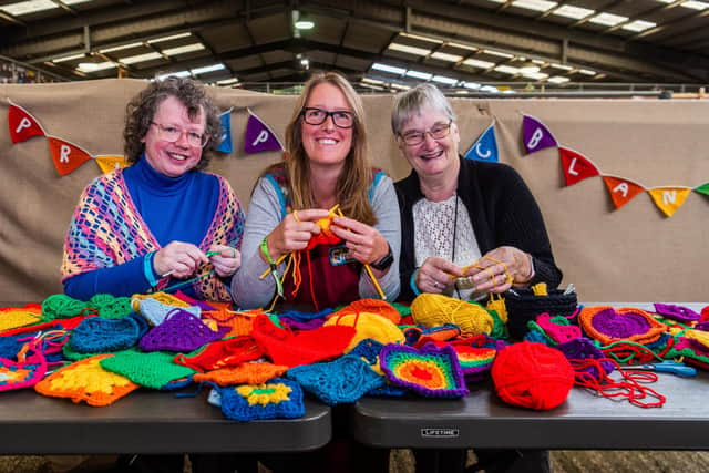 Gillian Humphrey, from Keighley, Emma Sando, and Jenny Snashall, from Oxfordshire busy crocheting squares for the Pride and Picnic blanket, another project Yarndale is invovled with