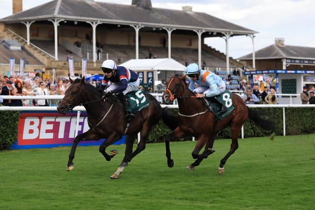 FRONT-RUNNER: Night In Vegas and Charles Bishop on their way to winning the Weatherbys 300,000 2-Y-O Stakes on day one of the Betfred St Leger Festival at Doncaster. Picture: Nigel French/PA.