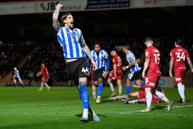 AERIAL PRESENCE: But Barnsley forced  Sheffield Wednesday centre-back Aden Flint into an error with their pressing at Oakwell