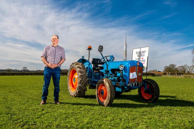 The Beadlam Charity Tractor run are holding their 21st annual event this year on the 30th April starting from Wombleton Airfield with over 180 tractors taking part travelling the 50 mile route all in aid of Yorkshire Air Ambulance. Pictured Organiser Malcolm Simpson, next to his vintage tractor. Picture By Yorkshire Post Photographer,  James Hardisty.