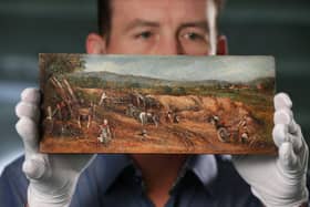 Dr Alex Surtees of Bradford University's forensic science department with The Sandpit, one of three oil paintings being tested for scientific evidence that they may be by the renowned English artist John Constable (1776-1837). Pic: Lorne Campbell / Guzelian
