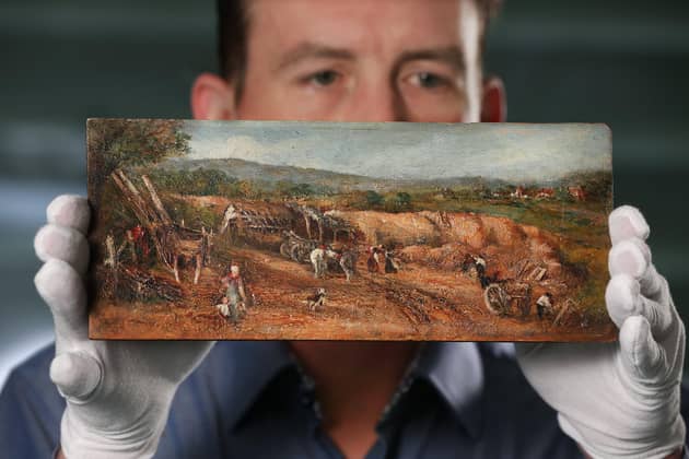 Dr Alex Surtees of Bradford University's forensic science department with The Sandpit, one of three oil paintings being tested for scientific evidence that they may be by the renowned English artist John Constable (1776-1837). Pic: Lorne Campbell / Guzelian