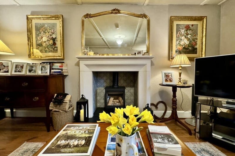 The sitting room is smart and traditional with some warm touches