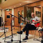 Jonathan Beardsworth playing guitar in the studio, as the new single was recorded. Photo: Dementia Forward/YODA