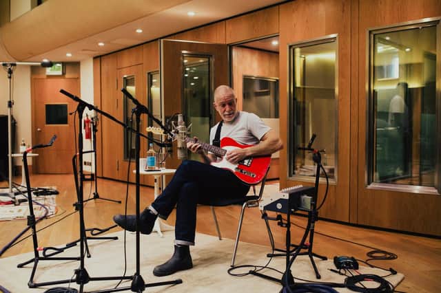Jonathan Beardsworth playing guitar in the studio, as the new single was recorded. Photo: Dementia Forward/YODA