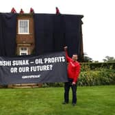 Greenpeace activists climb onto the roof of the Prime Minister's £2m manor house in Yorkshire in protest at his backing for a major expansion of North Sea oil and gas drilling amidst a summer of escalating climate impacts (Photo: Greenpeace)