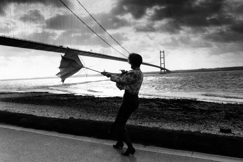 Tracey Jackson fights to keep control of her umberella underneath the storm lashed Humber Bridge, which was closed to high-sided vehicles because of the winds in October 1991.