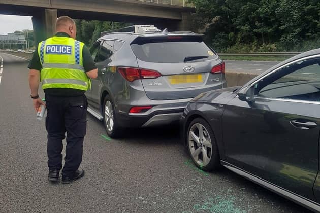 John Barlow's Hyundai car (left) that stopped an Audi on the outside lane of the M62 near Leeds after the Audi driver suffered a suspected seizure