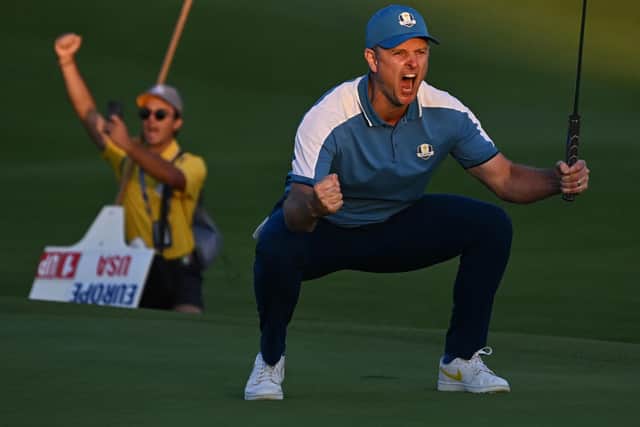 Europe's English golfer, Justin Rose celebrates holing a putt to tie his four-ball match on the first day of play in the 44th Ryder Cup (Picture: PAUL ELLIS/AFP via Getty Images)