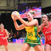 Rivalry renewed: Australia's Sophie Garbin, left, evades England's Geva Mentor, right, during the final of the Netball World Cup in Cape Town in August (Picture: RODGER BOSCH/AFP via Getty Images)