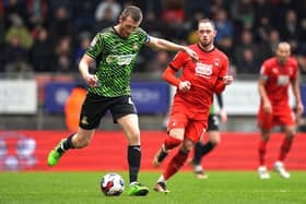 TOUGH DAY: Doncaster Rovers' Tom Anderson (left) and Leyton Orient's Theo Archibald battle for the ball at the Breyer Group Stadium. Picture: Kirsty O'Connor/PA