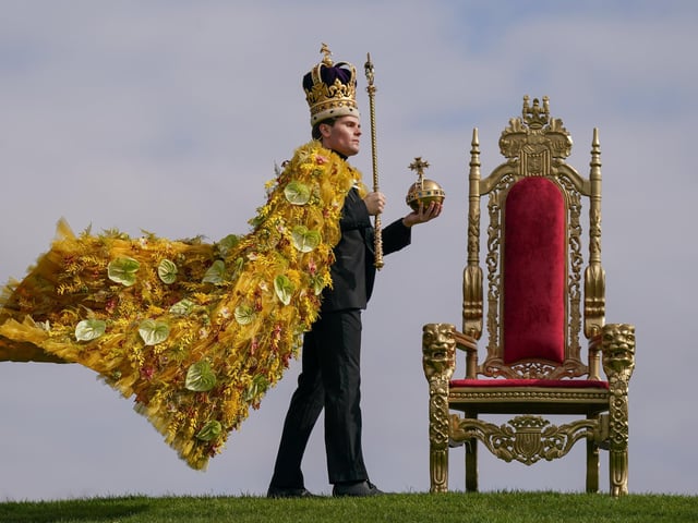 HARROGATE, ENGLAND - APRIL 19: Rupert North wears the floral coronation cloak, designed by award-winning, Harrogate based florist Helen James during a photo call on staging day of the Spring Flower Show. (Photo by Ian Forsyth/Getty Images)