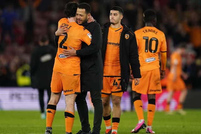 Hull City manager Liam Rosenior (centre left) embraces Hull City's Lewis Coyle following the Sky Bet Championship victory at Southampton (Picture: Adam Davy/PA Wire)