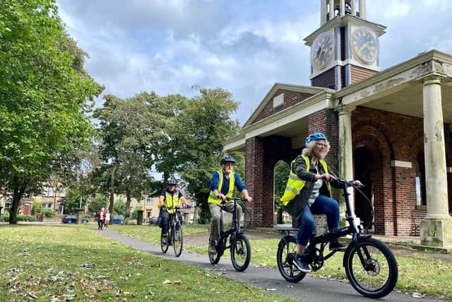 Participants trying out e-bikes with EPIKS