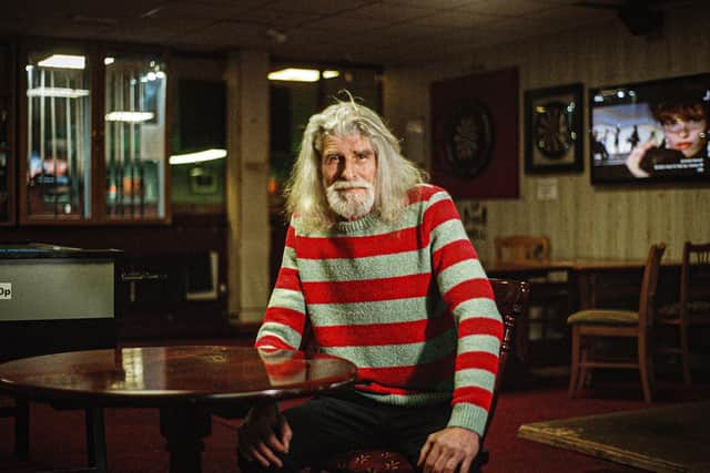 Musician Steve Brodie wears The RAKER Jones Stripe in Dusty Green and Red, £75 at raker.shop, photographed by Tom Atkin.