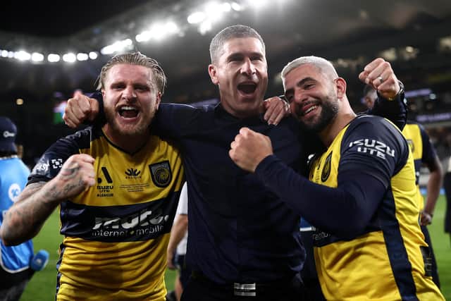 Mariners head coach Nick Montgomery (C) celebrates with Jason Cummings (L) and Christian Theoharous (R) of the Mariners after winning the 2023 A-League Men's Grand Final match between Melbourne City and Central Coast Mariners in June 2023, in Sydney, Australia. (Picture: Cameron Spencer/Getty Images)