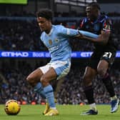 RELENTLESS ENERGY: Huddersfield Town' loanee Alex Matos (right) gets to grips with Manchester City's Oscar Bobb