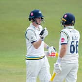 Well played, partner: Harry Brook, left, celebrates his century with Joe Root at Headingley on Saturday. Brook hit 126 not out and Root 119 as Yorkshire chase their first win of the season. Picture by Allan McKenzie/SWpix.com