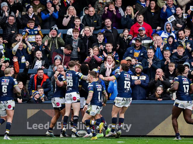 Tom Holroyd celebrates with team-mates after scoring a try. (Photo: Alex Whitehead/SWpix.com)