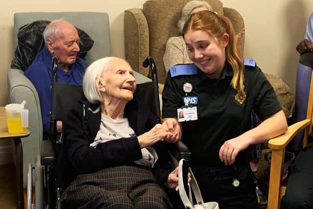 Student paramedic Grace Wolfenden with Thornhill Care Home resident Nancy Hayes.