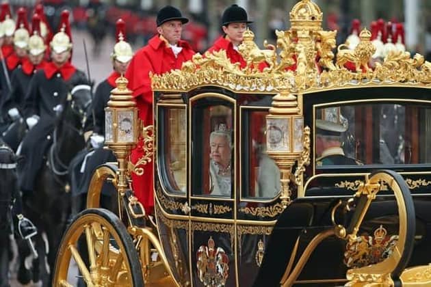 Queen Elizabeth II, accompanied by the Duke and Duchess of Cornwall, returns to Buckingham Palace, London, in the Diamond Jubilee State Coach, having delivered The Queen's Speech. PA Photo. Picture date: Monday October 14, 2019.