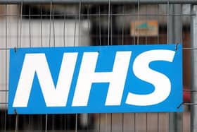 An NHS sign on a fence at a hospital. PIC: PA