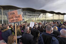 Demonstrators gather outside the terminal building at Doncaster Sheffield Airport