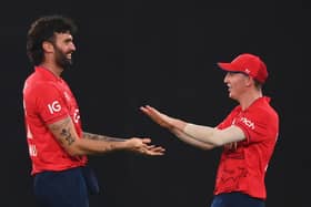 GOT HIM: England's Reece Topley celebrates with Harry Brook after taking the wicket of Mohammad Rizwan. Picture: Alex Davidson/Getty Images