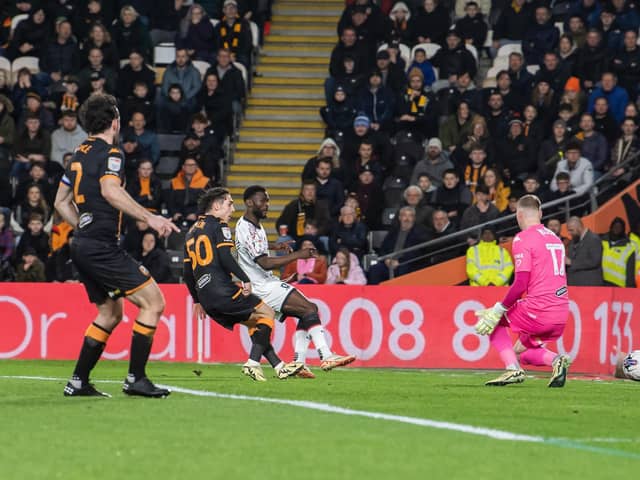 Middlesbrough's Emmanuel Latte Lath squeezes the pall past Hull City keeper Ryan Allsop to Boro ahead in a see-saw Championship contest with Hull City. Picture: Tony Johnson.