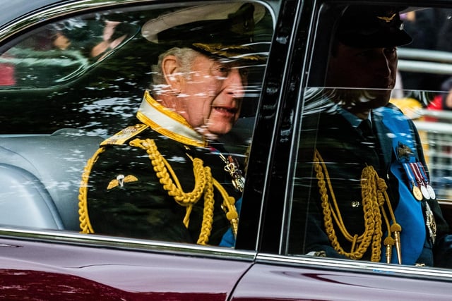 The State Funeral of Her Majesty The Queen Elizabeth II making it's way along The Mall, London. Pictured King Charles III, heading to Westminster Abbey.