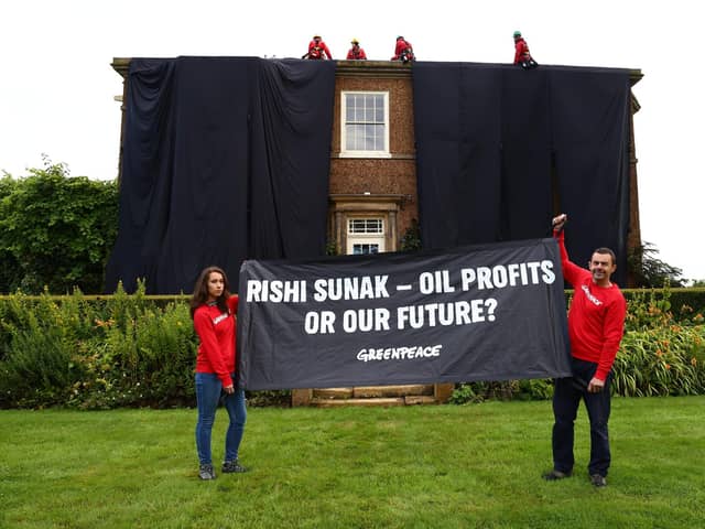 Greenpeace activists climb onto the roof of the Prime Minister's £2m manor house in Yorkshire this morning in protest at his backing for a major expansion of North Sea oil and gas drilling amidst a summer of escalating climate impacts (Photo: Greenpeace)