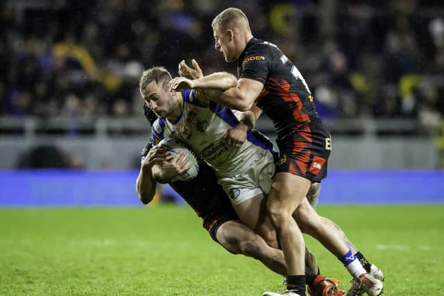 Leeds' Jarrod O'Connor is tackled by St Helens. (Picture: SWPix.com)