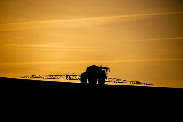 A farmer sprays crops in the field. PIC: James Hardisty