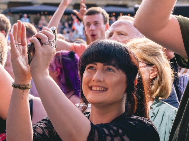 A close up of Piece Hall concert goers.