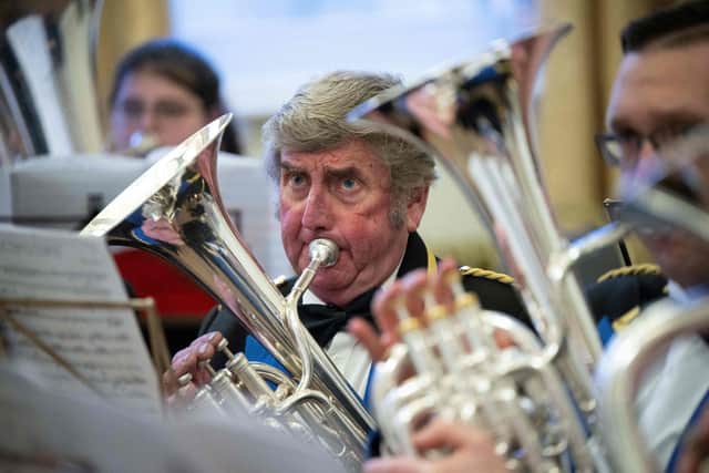 TOPSHOT - Musicians from Meltham and Meltham Mills band prepare to compete in the Yorkshire Brass Band Championships in the Town Hall in Huddersfield, northern England on March 4, 2023. - Over fifty bands, across 5 grading sections, will compete for the honour of representing Yorkshire at the finals of the National Brass Band Championships of Great Britain - the largest brass band competition series in the World. (Photo by OLI SCARFF / AFP) (Photo by OLI SCARFF/AFP via Getty Images)