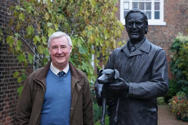 Peter Wright with a statue of his former mentor Alf Wight. Photo: Peter Wright