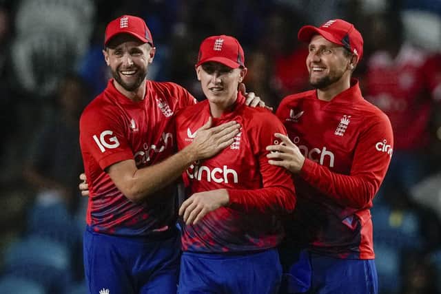 CATCH ME IF YOU CAN: Chris Woakes (left) and Liam Livingstone (right) congratulate England's Harry Brook for taking the catch to dismiss West Indies' Nicholas Pooran during the fourth T20 cricket match at Brian Lara Stadium in Tarouba Picture: AP Photo/Ricardo Mazalan