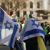 People with flags during a pro-Israel rally in Trafalgar Square. PIC: Jeff Moore/PA Wire