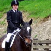 Oliver pictured riding BLS Bailey where they finished in First Place in the Grade 4 Championship Dressage Class.