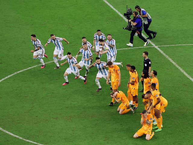 Argentina players including Nicolas Otamendi celebrate in front of the Netherlands players after winning the penalty shootout against the Netherlands in the World Cup quarter-final (Picture: Elsa/Getty Images)